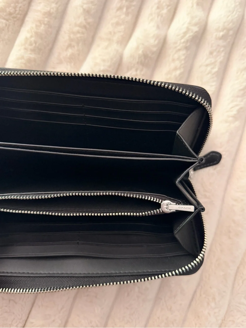 Coach slim zip